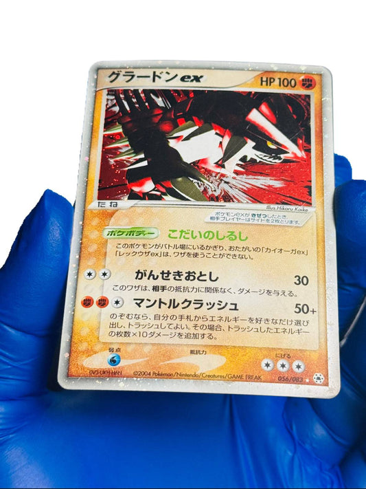 Holo Pokémon card featuring Groudon EX from BlueGloveTCG, showing vibrant artwork and collectible game card details.