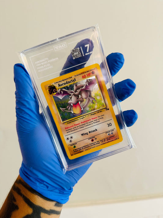 BlueGloveTCG Aerodactyl Fossil 1/62 single trading card with TAG 7, near mint condition, detailed illustration of fossil Pokémon.