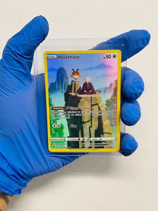 Hoothoot TG single trading card by BlueGloveTCG featuring artwork of a round, owl-like Pokémon with large eyes and brown feathers.
