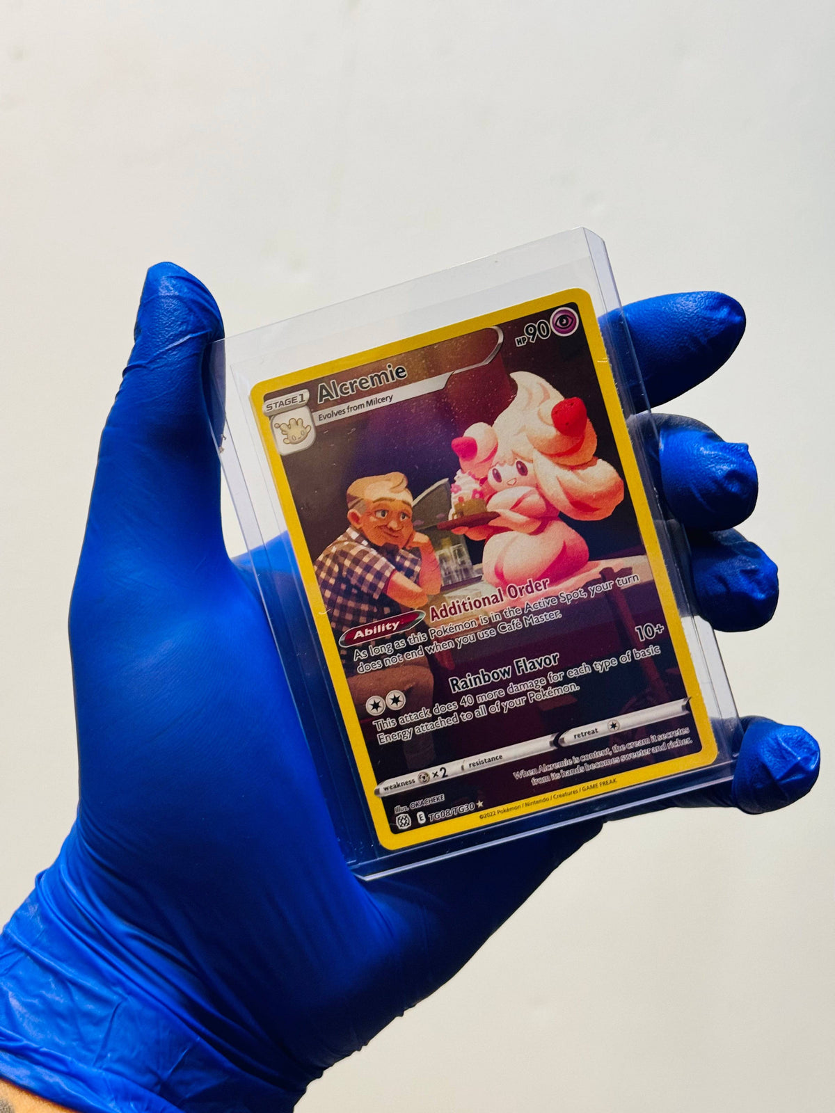 BlueGloveTCG Alcremie TG8 Pokémon single card, BC26256D-0DF3-4D11-8436-A879B57CBAD8, with colorful illustration.