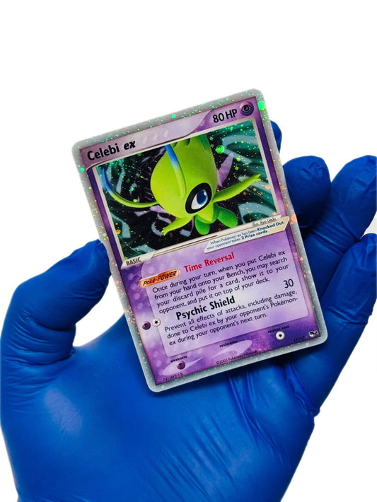 Celebi Ex holographic Pokémon card from Pop Series 2, featuring detailed artwork and vibrant colors by BlueGloveTCG.