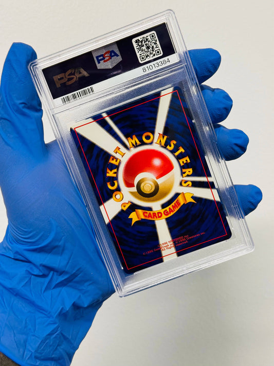Togetic 2000 Neo Genesis PSA 7 single Pokémon card by BlueGloveTCG, featuring artwork of Togetic in a vibrant setting.