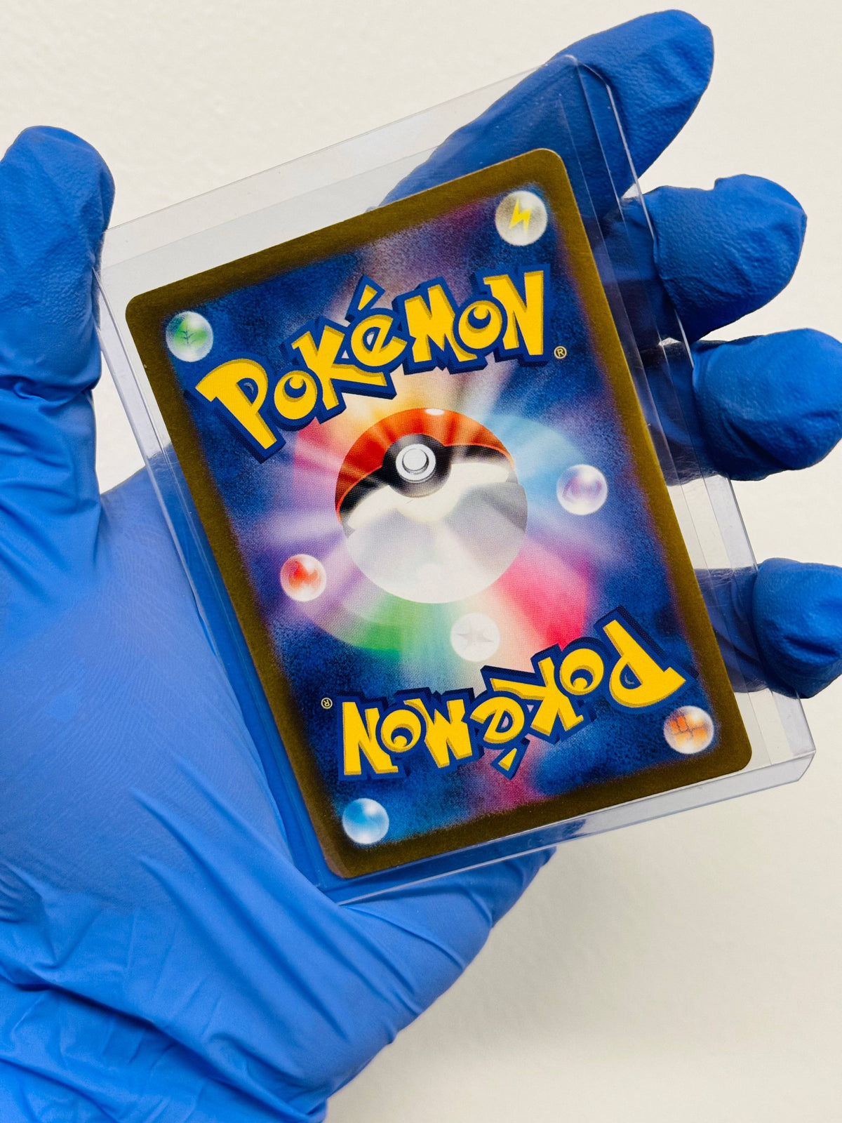 Reuniclus AR Pokémon card from BlueGloveTCG featuring detailed artwork and vibrant colors on a white background.